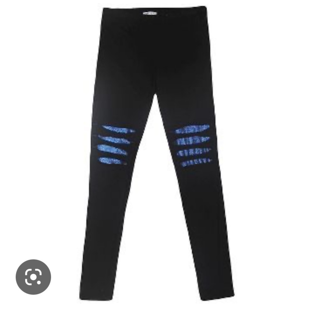 Super cool black leggings with ripped knees and blue fabric underlay.